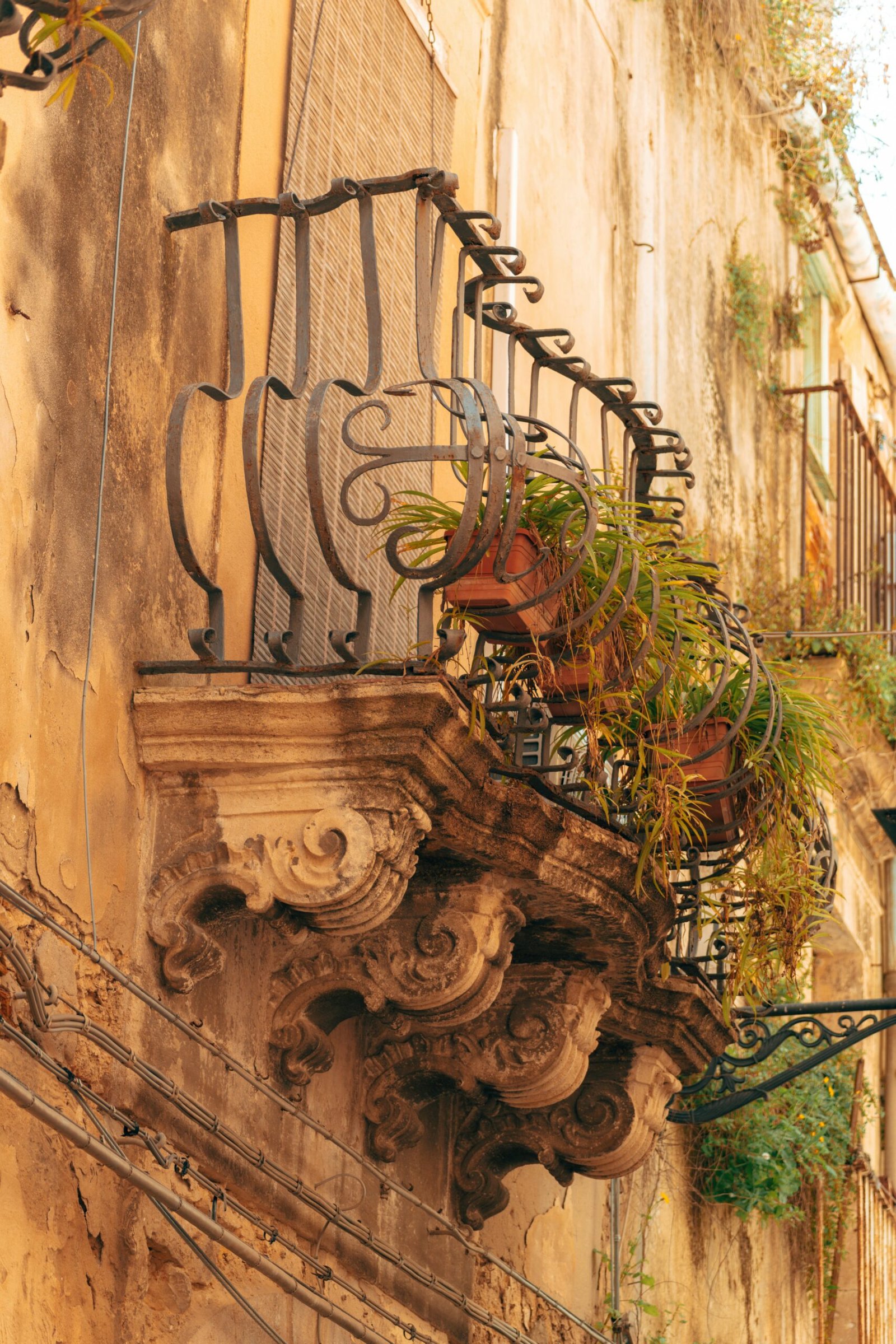 a balcony with a planter on the side of it